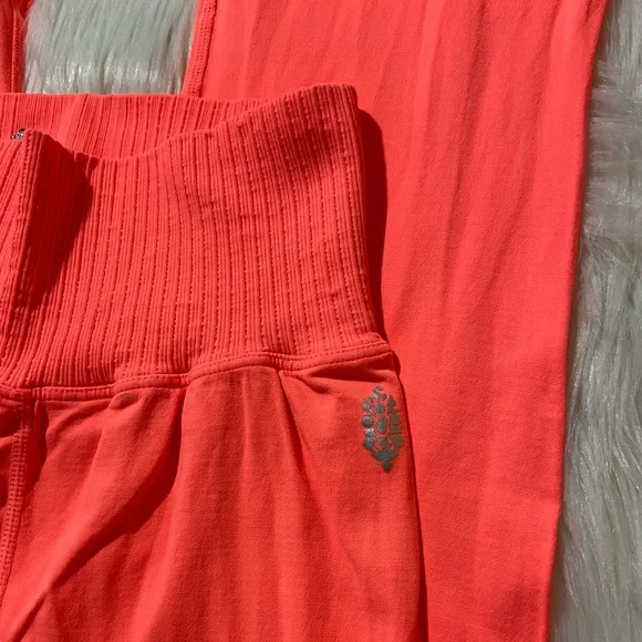 21. New FP Movement Good Karma Leggings in Neon Coral - Picture 4 of 6